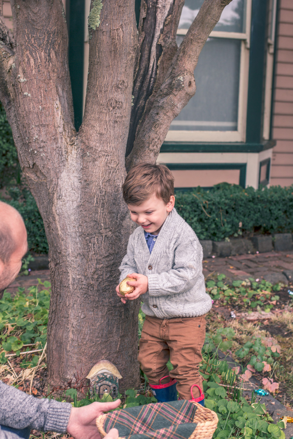 Toddler wearing vintage style boys knitwear for Autumn easter egg hunt