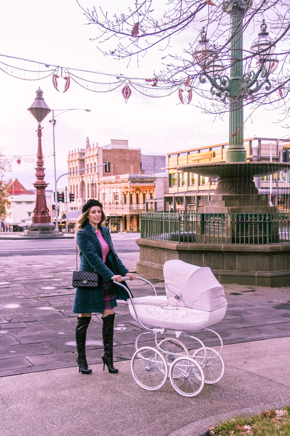 Goldfields Girl walking in Ballarat with vintage pram dressed in Alannah Hill top and skirt 