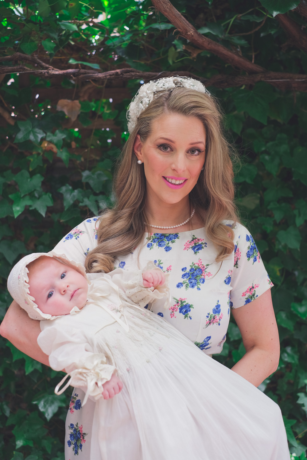 Deneale Goldfields Girl holding daughter in her Christening gown