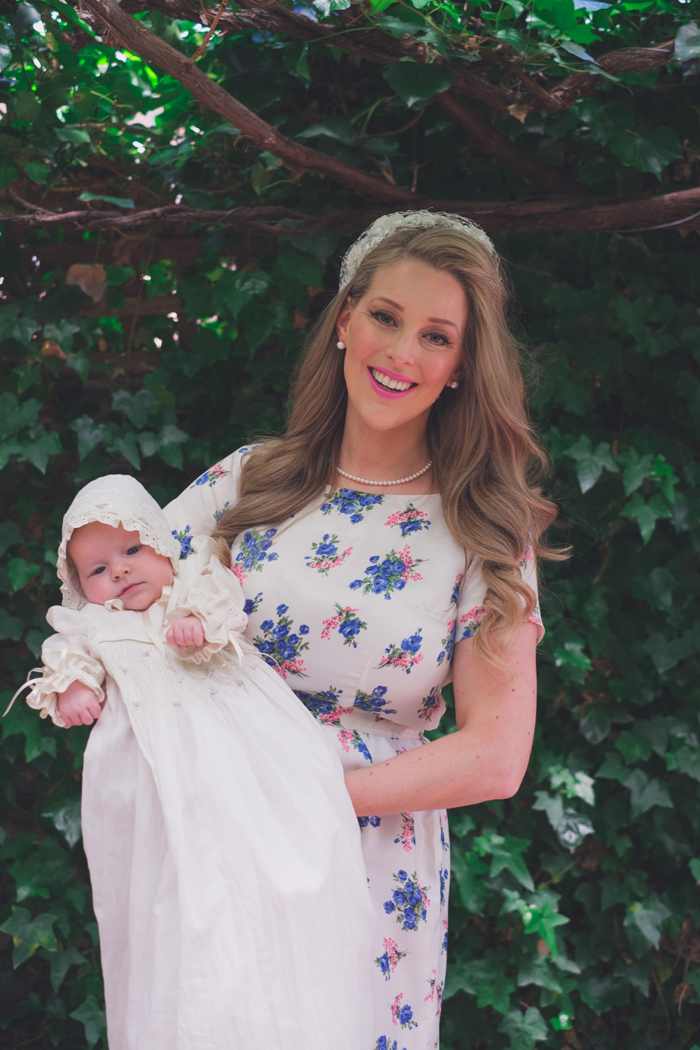 Deneale Goldfields Girl holding her daughter who is wearing an antique Christening gown