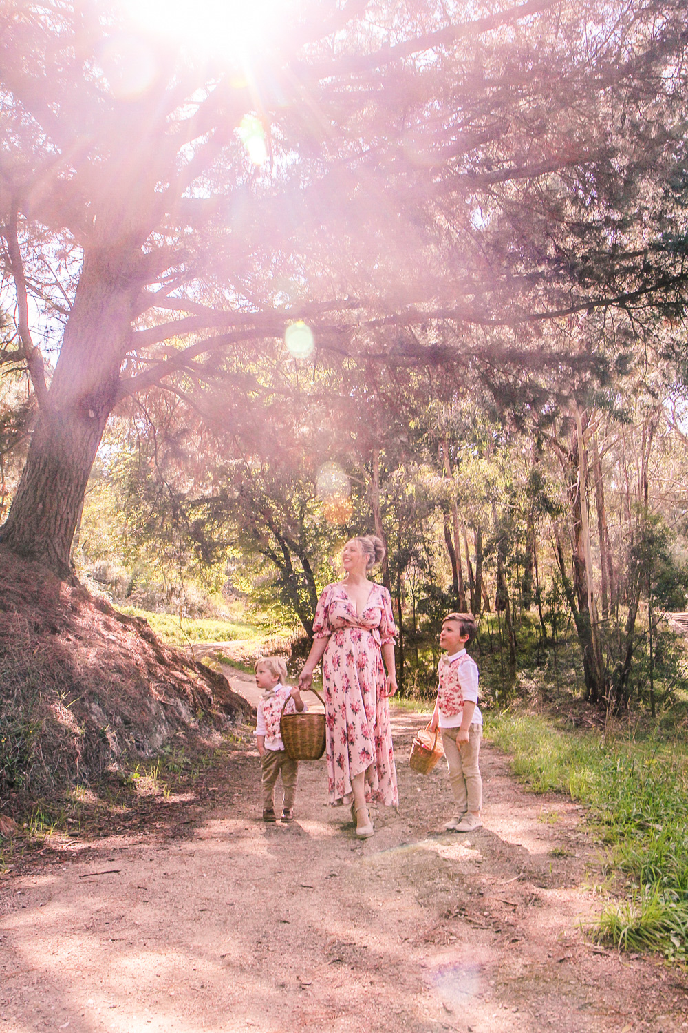 Goldfields Girl walking along forest trail with little boys all holding berry baskets