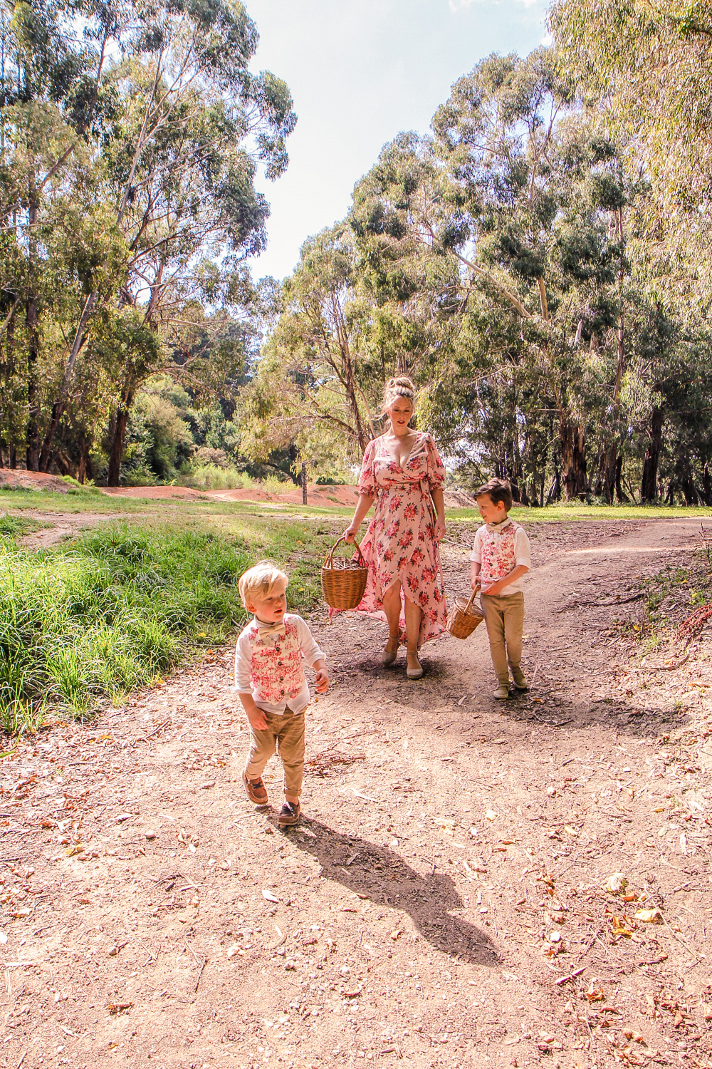 Goldfields Girl walking along forest trail with little boys all holding berry baskets